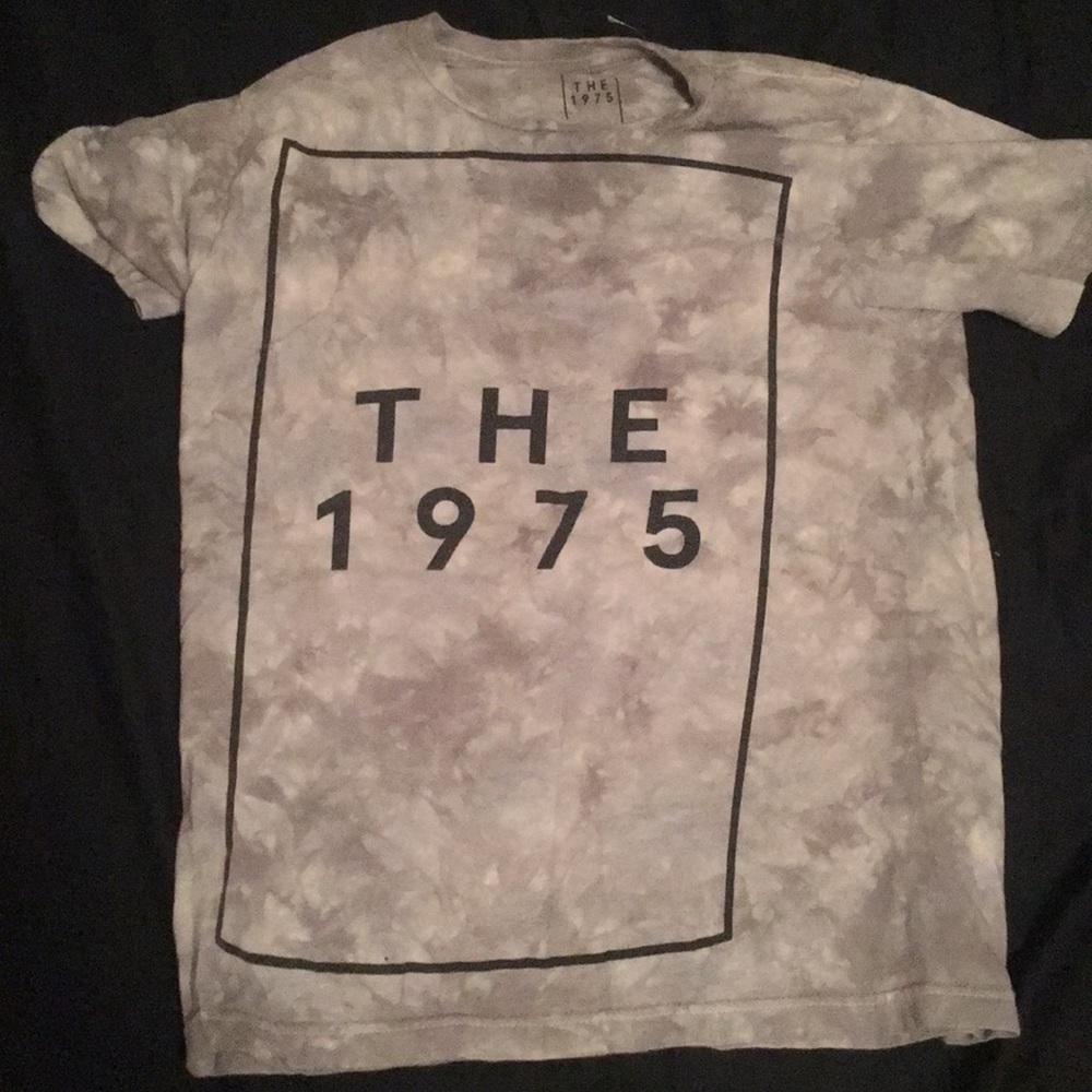 A "The 1976" t-shirt